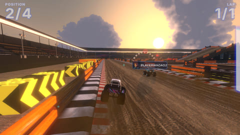 Multiplayer trucks racing on sand through a stadium at sunset